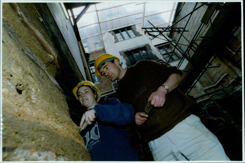 Archaeologists uncover 900-year-old house foundations while excavating Lincoln College's kitchens. - Vintage Photograph