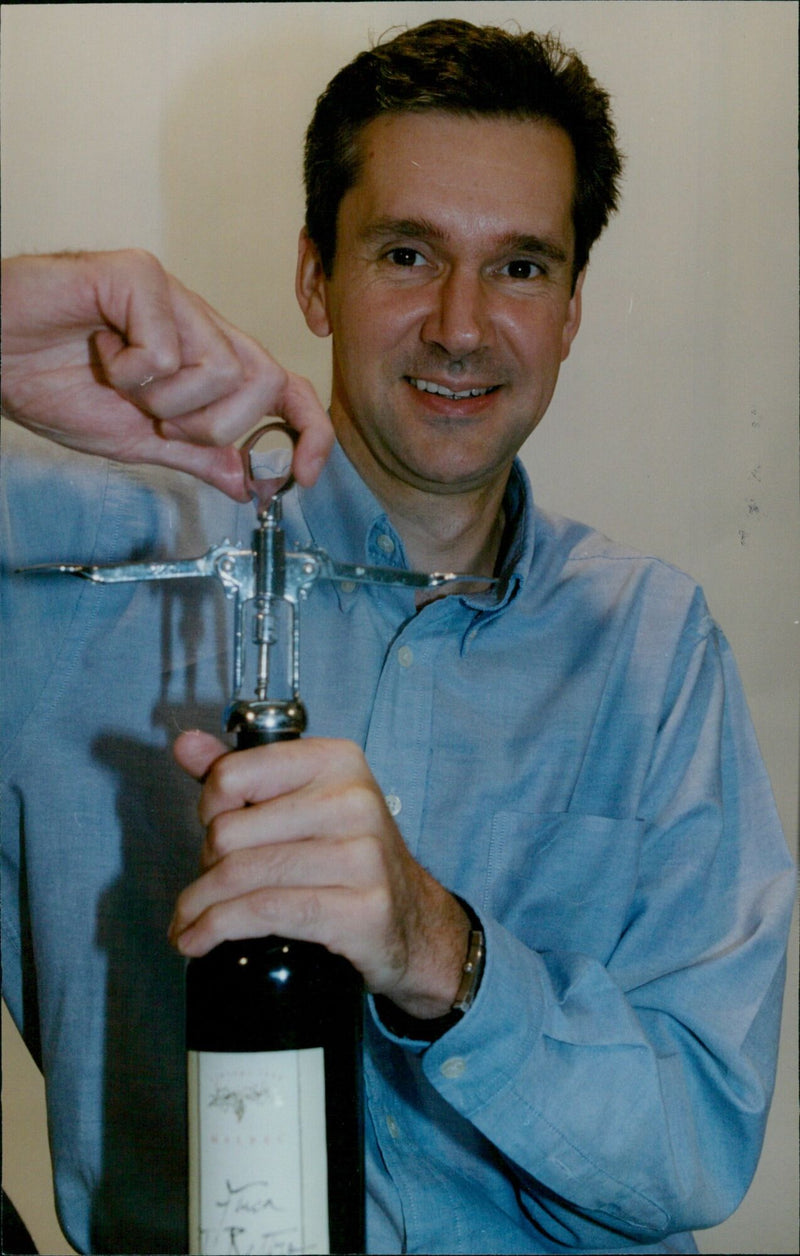 Wine expert John Stimfig tastes a glass of wine in Oxfordshire. - Vintage Photograph