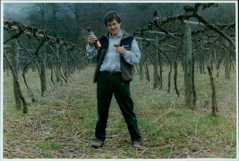 David Ealand, owner of the Old Luxters Vineyard Winery & Brewery, poses with the award-winning Oxford Landing Wines & Spirits. - Vintage Photograph