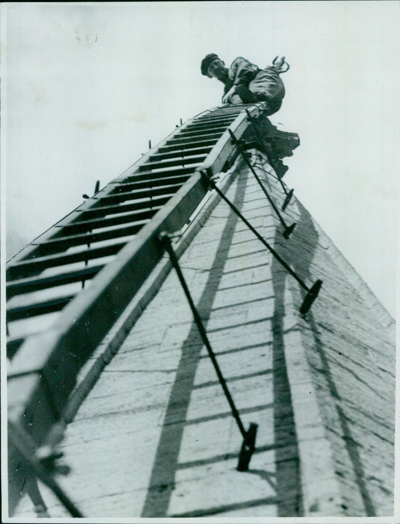 Construction workers on the job at the top of the spire of Chine Grid City Church - Vintage Photograph