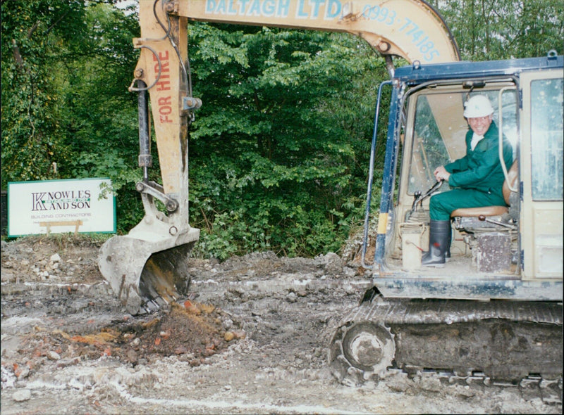 University students watch as construction begins on their lodgings. - Vintage Photograph