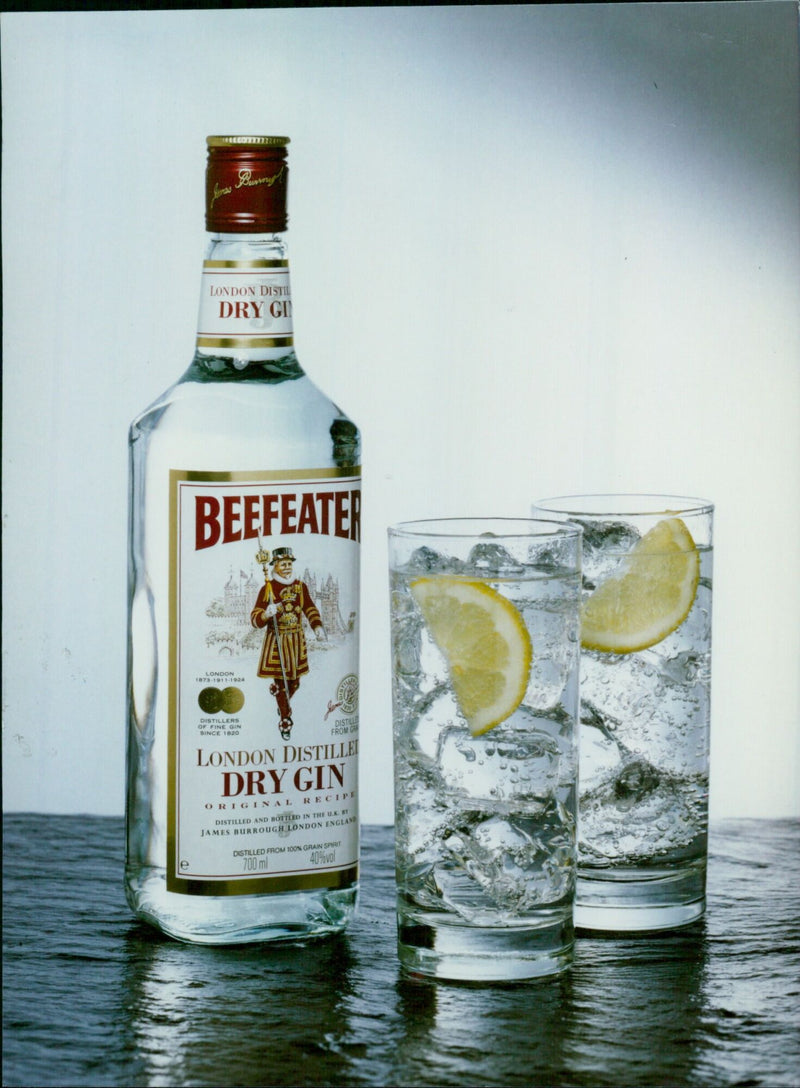 A bottle of Beefeater London Dry Gin, distilled and bottled in the U.K. by James Burrough London England. - Vintage Photograph