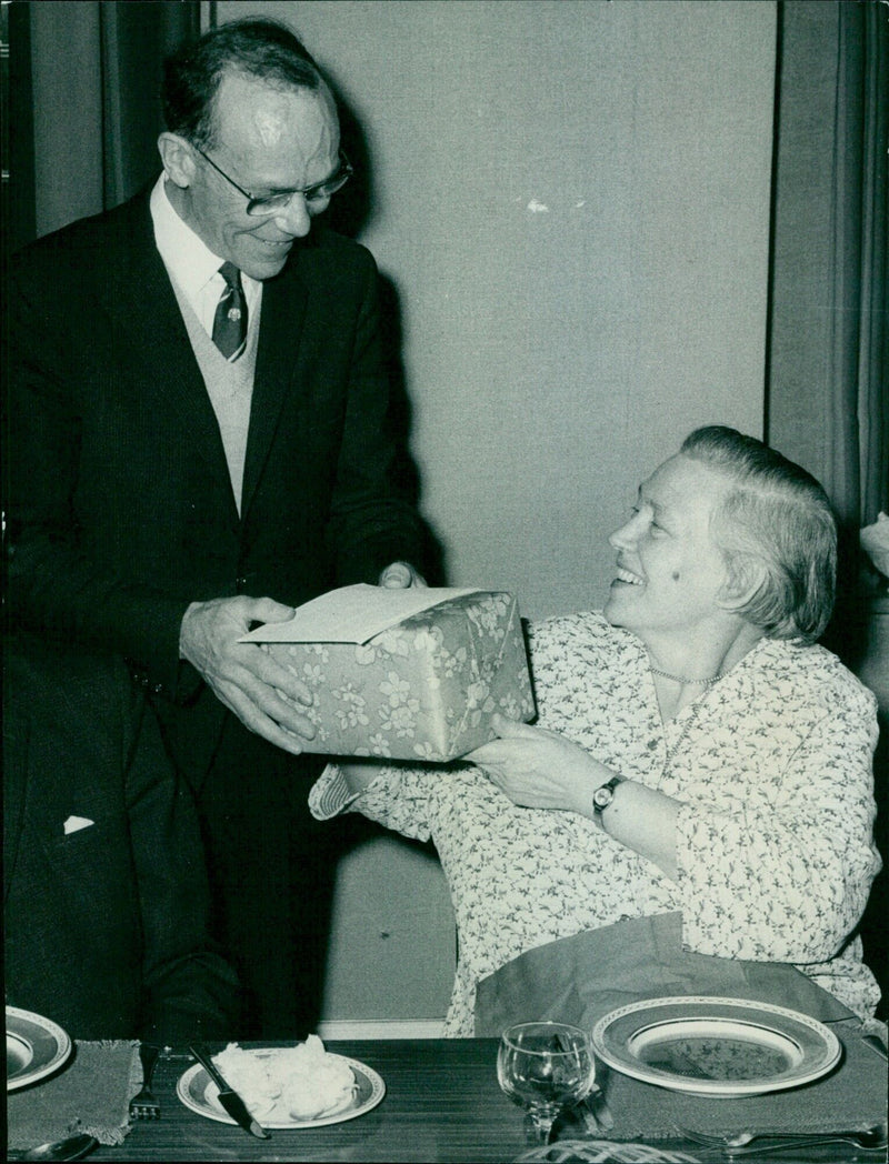 Lord Mayor's chauffeur, Laurie Biggs, receives a gift from Mrs. Ethel Davies. - Vintage Photograph