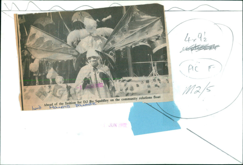 DJ Bo Squddley stands on the community relations float at the Mayon's parade. - Vintage Photograph