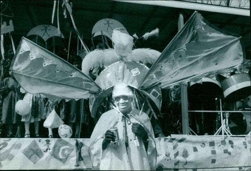 DJ Bo Squddley stands on the community relations float at the Mayon's parade. - Vintage Photograph