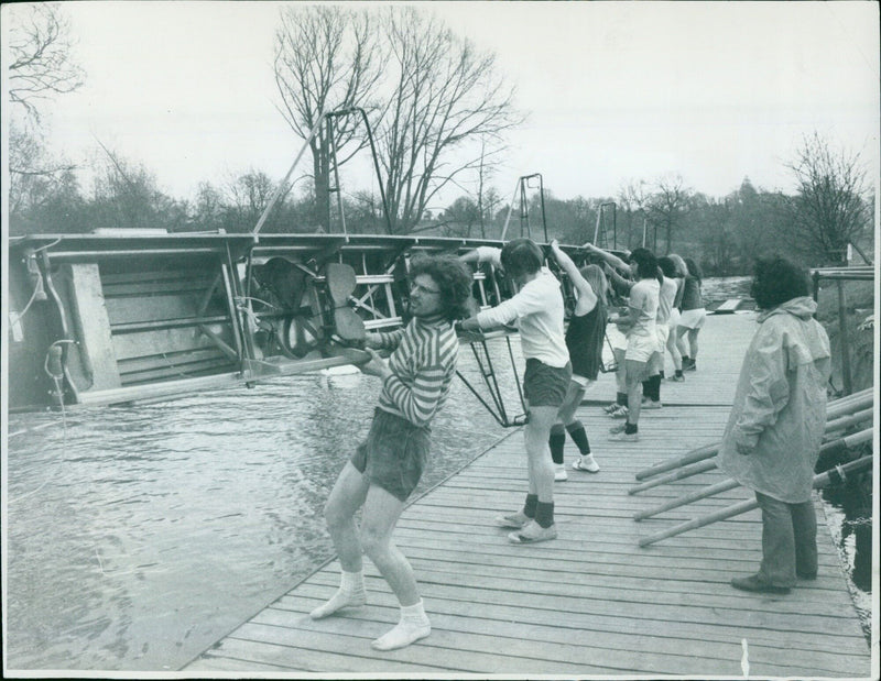 Eight students from Keble College embark on a 100-mile sponsored row down the Thames to raise money for the college's centenary appeal. - Vintage Photograph