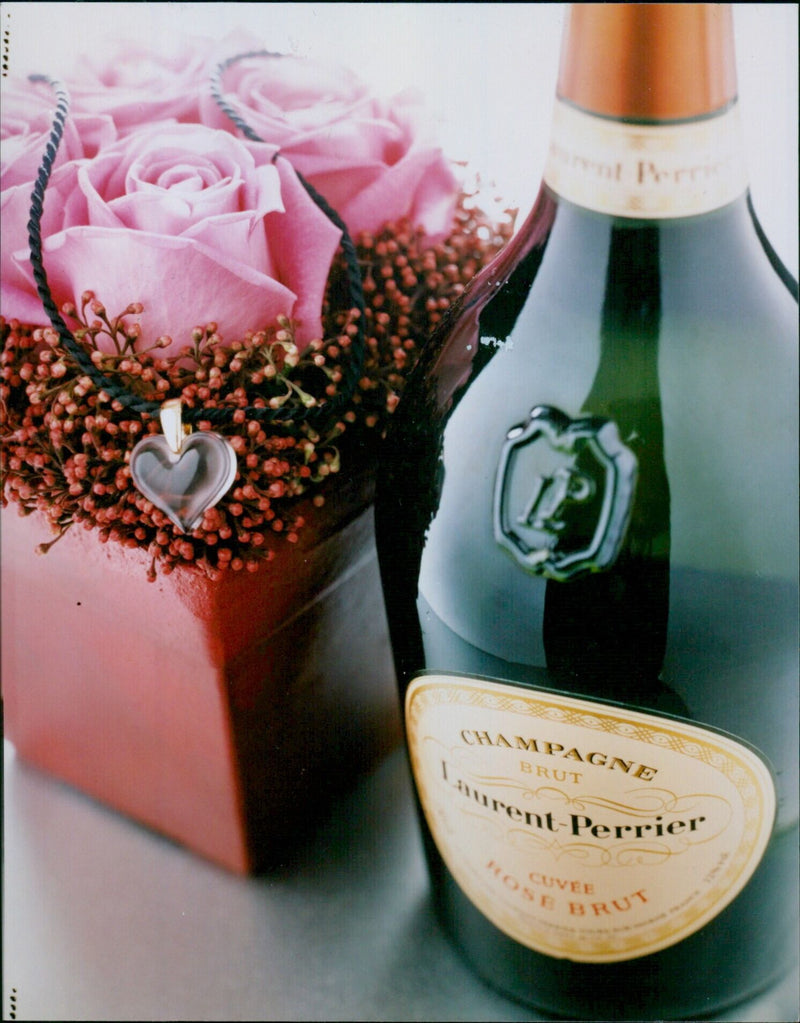 Three bottles of Laurent-Perrier Cuvée Rosé Brut champagne. - Vintage Photograph