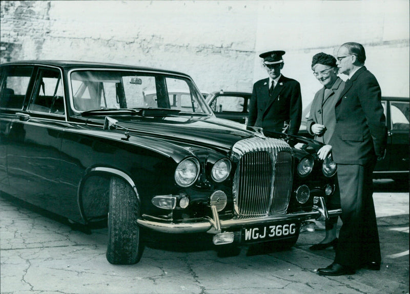 Ald. and Mrs. Peter Spokes take a first look at the new Daimler limousine which is to replace their eight-year-old Austin Princess FC 1 as the mayoral car. - Vintage Photograph