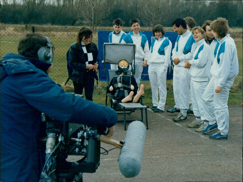 Members of the White Team celebrate after winning their car run race. - Vintage Photograph