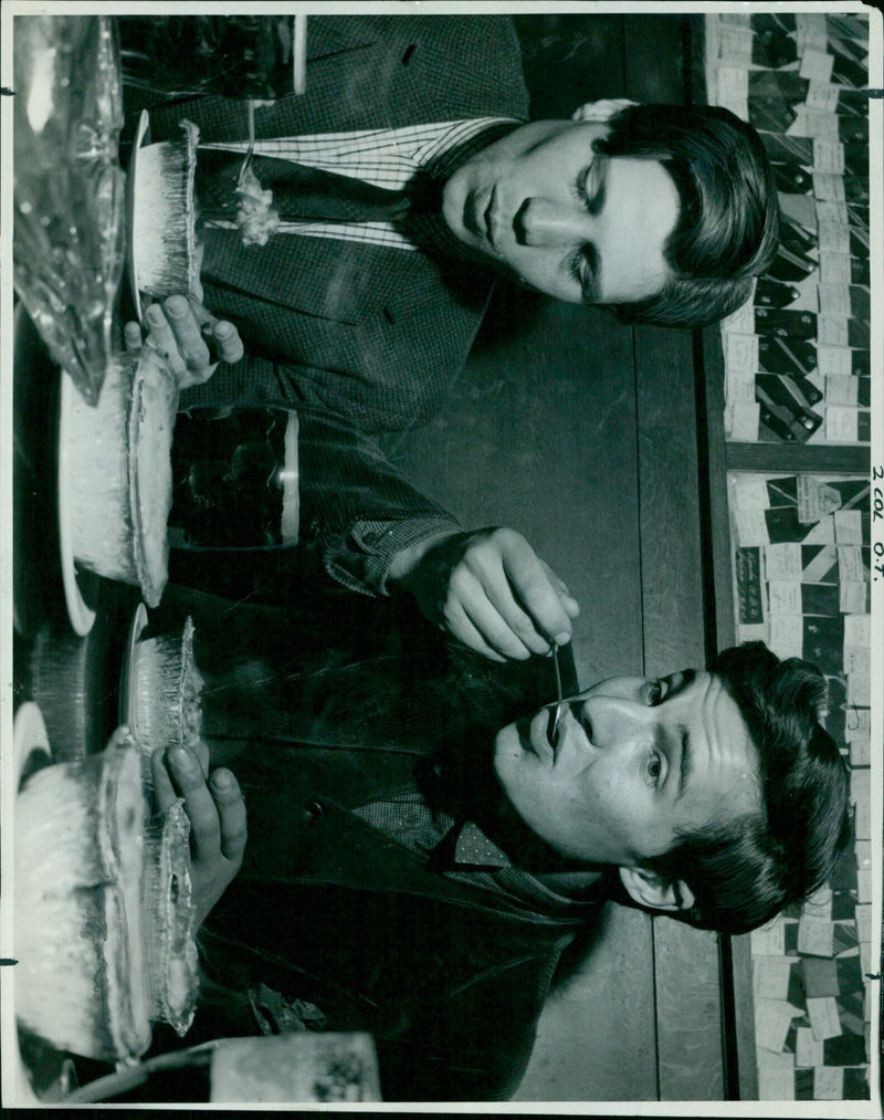 Two students wearing protective masks and face shields walk on campus. - Vintage Photograph