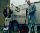 Dave Clarke and Bill Gardner of Beckley Cleaners demonstrate window cleaning equipment. - Vintage Photograph