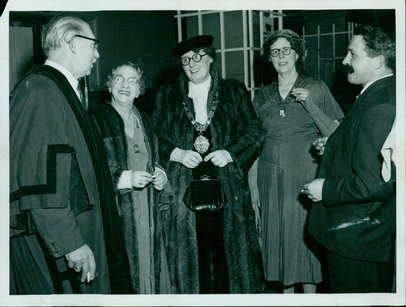 Guests at a sherry party hosted by the Mayor and Mayoress of Woodstock at the Town Hall. - Vintage Photograph