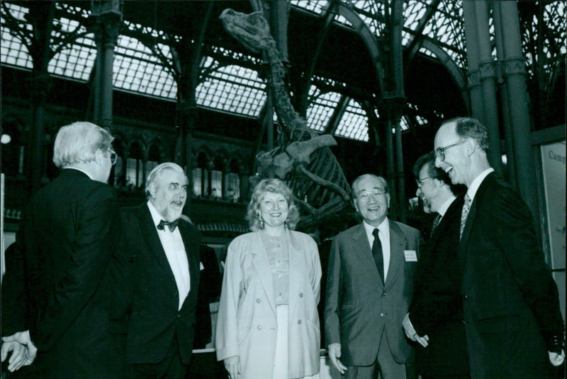 Mr Minoru Masuda, Chairman of the Japanese Economic Foundation, chats with other business leaders at the Camp 16 Business Link Hoe Reception at the University Museum in Oxford. - Vintage Photograph