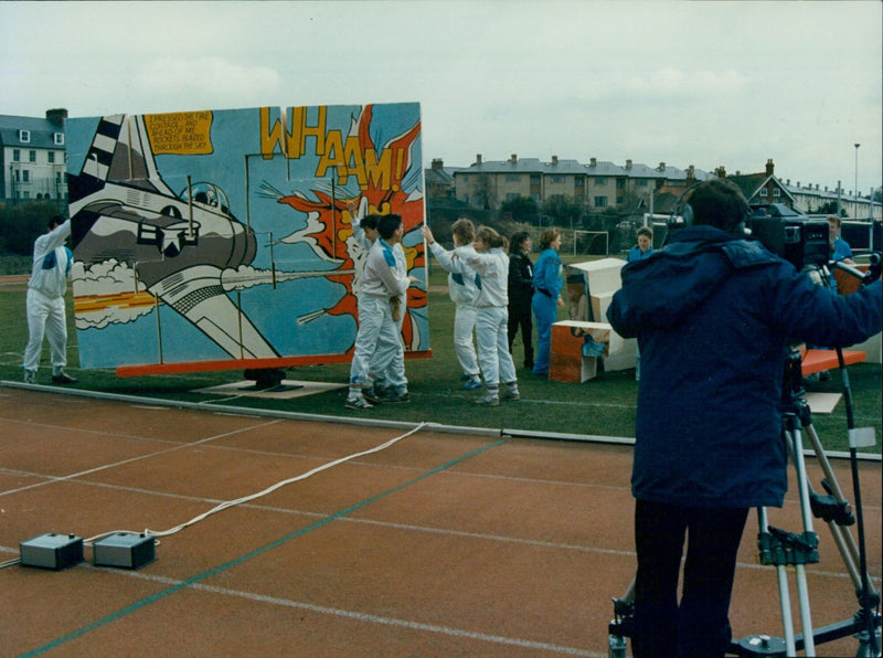 White team members celebrating after completing a wall at Euroversity. - Vintage Photograph