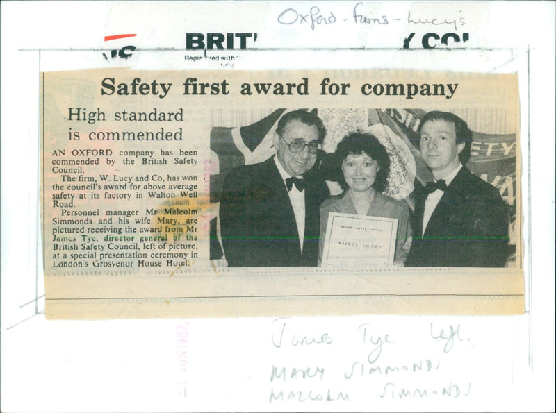 Mr James Tye, director general of the British Safety Council, presents an award for safety excellence to personnel manager Mr Malcolm Simmonds and his wife Mary. - Vintage Photograph