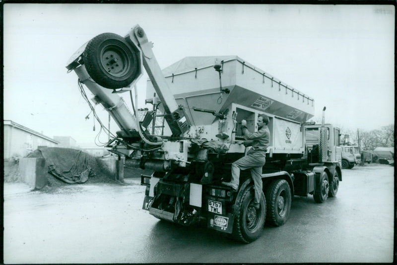 Salt spraying lorry being checked in winter conditions. - Vintage Photograph