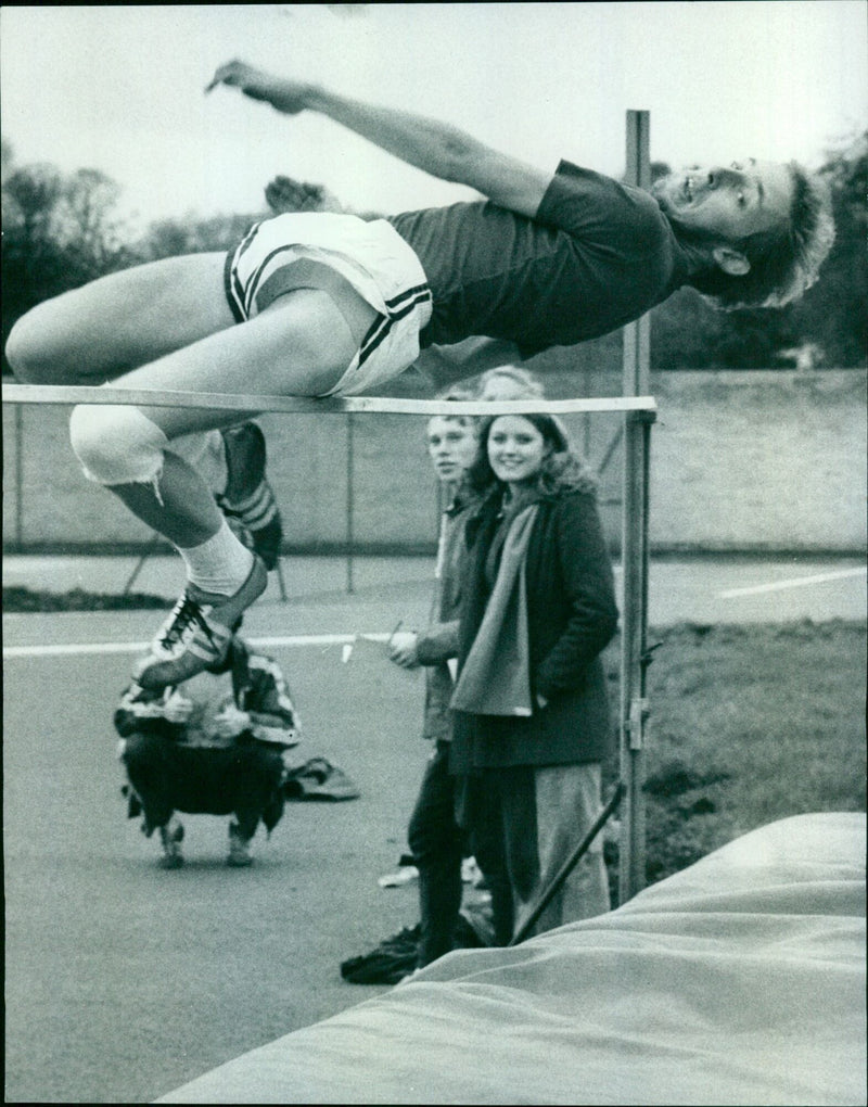 Oxford University's Phil Henderson competes in the high jump during a Varsity athletic match. - Vintage Photograph