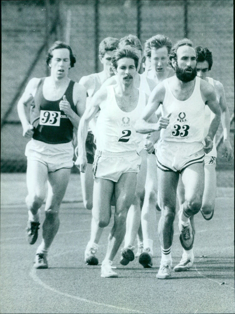 Nicholas Brawn leads the field during the 5000 metres race at the Varsity Match in Oxford, England. - Vintage Photograph