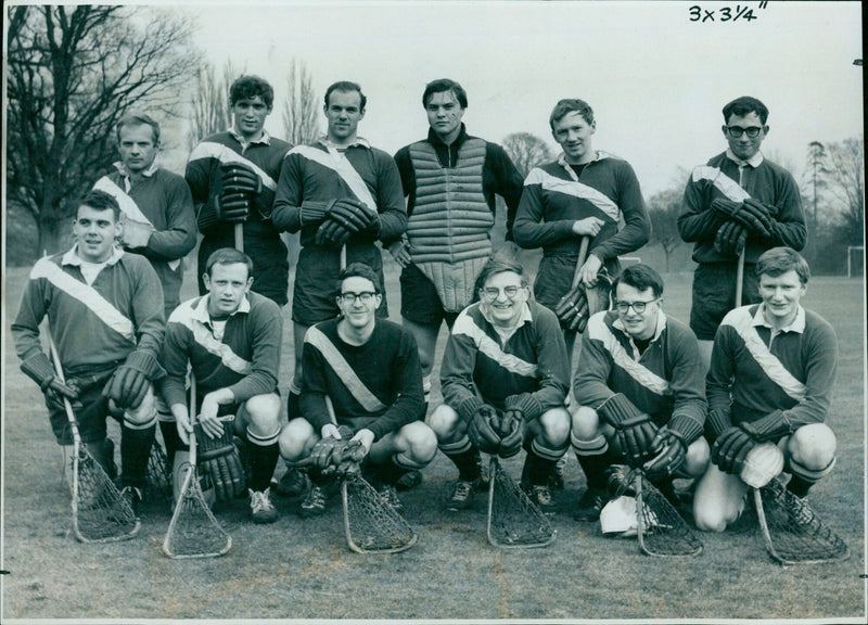 Members of a lacrosse team pose for a photograph on February 6, 1965. - Vintage Photograph