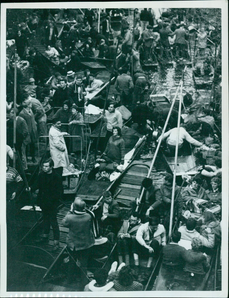 People take part in a demonstration in a busy street. - Vintage Photograph