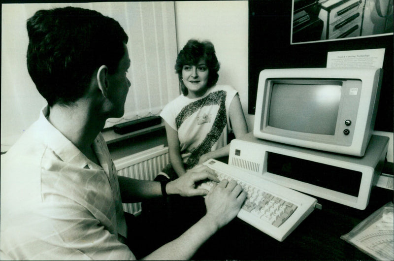 Dr. P. Alman from Oxford University evaluates data fed into a computer. - Vintage Photograph