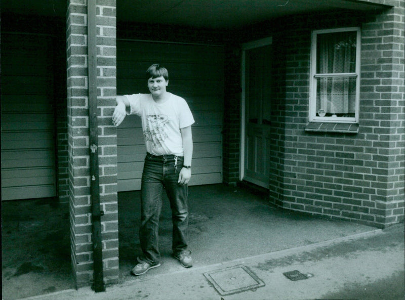 Steven Wilhams poses outside his father's garage in Oxford. - Vintage Photograph