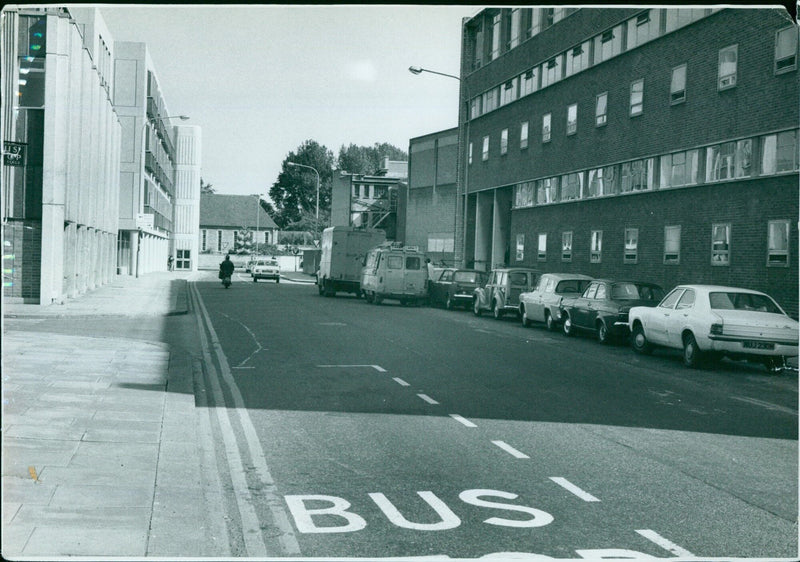 A bus driver performs a wheelie on Speedwell Street in Oxford, England. - Vintage Photograph