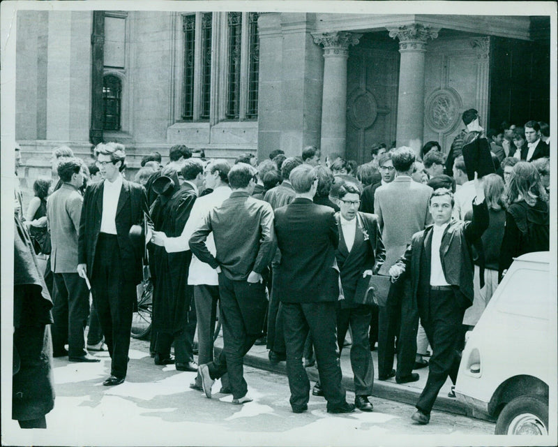 Students take their exams at the Examination Schools in Oxford. - Vintage Photograph