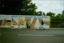 Students from the Oxford Polytechnic Foundation painting a mural on Magdalen Bridge in Oxford, England. - Vintage Photograph