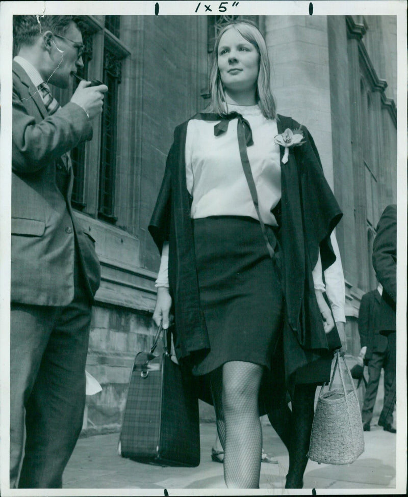 Oxford University students arrive at the Examination Schools on the gloomy day marking the beginning of their final exams. - Vintage Photograph