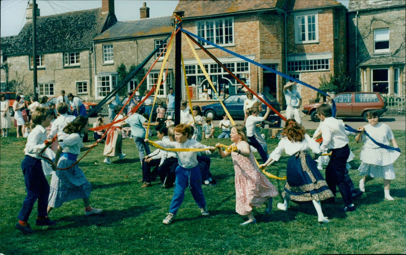 Pupils of Tackley Primary School celebrate May with maypole and country dancing on the village green. - Vintage Photograph