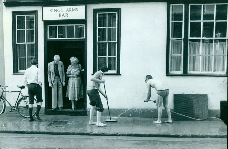 A group of people standing outside the Kings Arms Bar. - Vintage Photograph