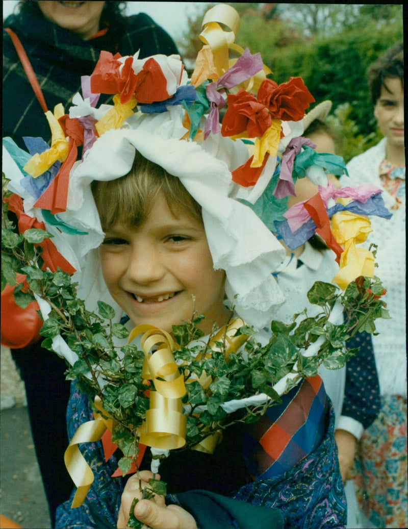 Seven-year-old Amy Pledge cheers on the traditional May Day garland walk across the fields between two Oxfordshire villages. - Vintage Photograph