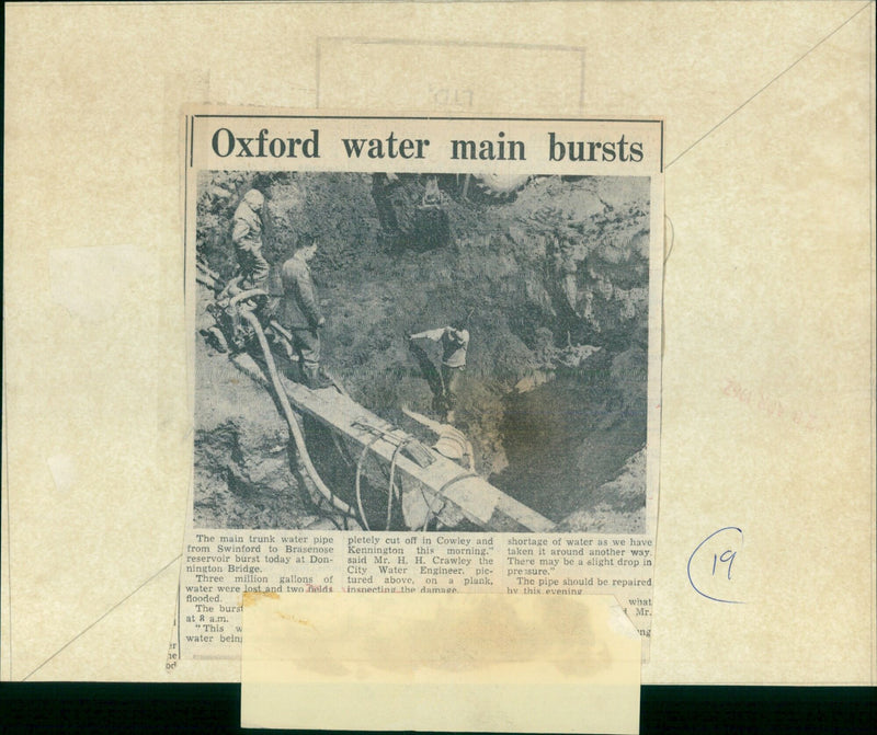 City Water Engineer Mr. H. H. Crawley inspects the damage caused by a main water pipe burst at Donnington Bridge. - Vintage Photograph