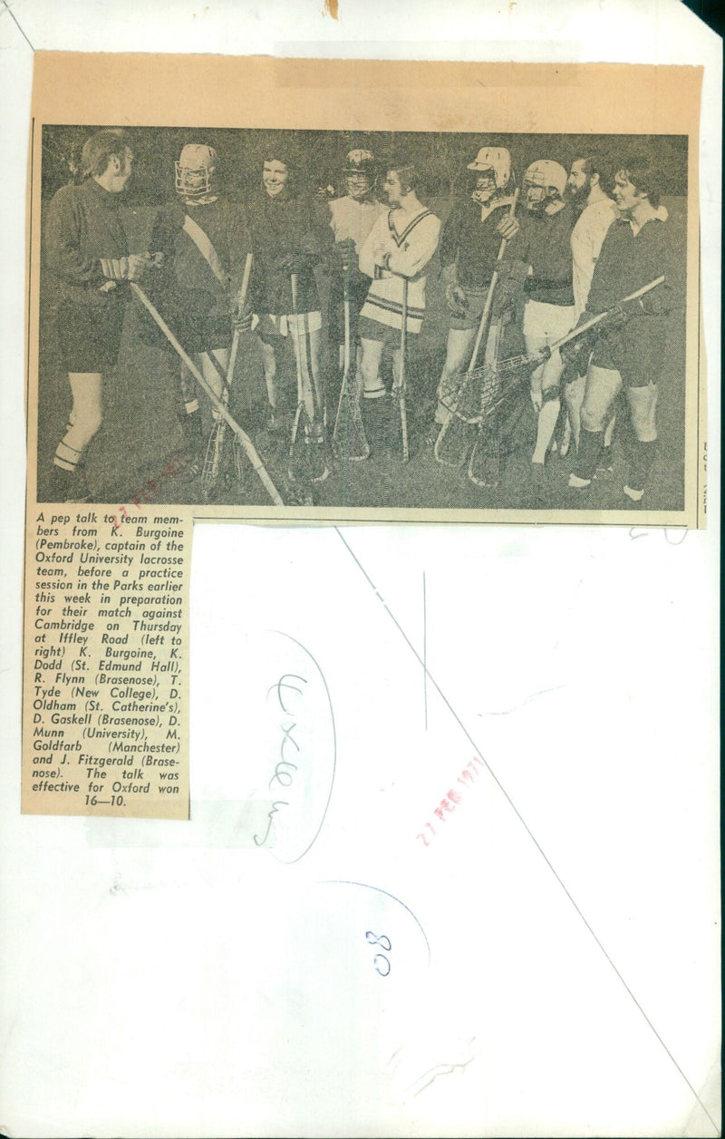 Oxford University lacrosse team captain K. Burgoine gives a pre-practice pep talk before their match against Cambridge. - Vintage Photograph