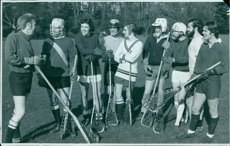 Oxford University lacrosse team captain K. Burgoine gives a pre-practice pep talk before their match against Cambridge. - Vintage Photograph