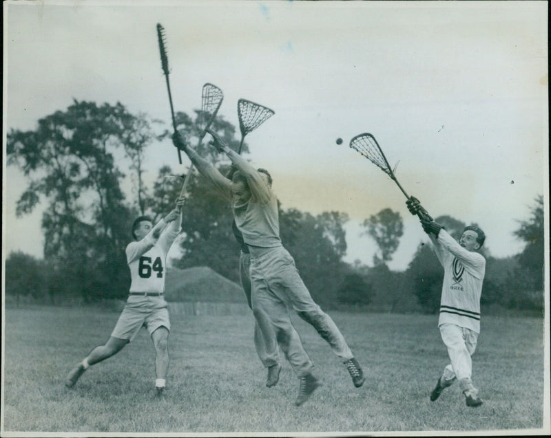 Students of the Oxford University Lacrosse Club in full gear during the opening practice match. - Vintage Photograph