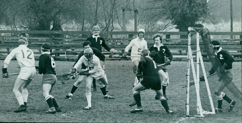 Oxford University's lacrosse team defends their goal against Cambridge University's attack. - Vintage Photograph