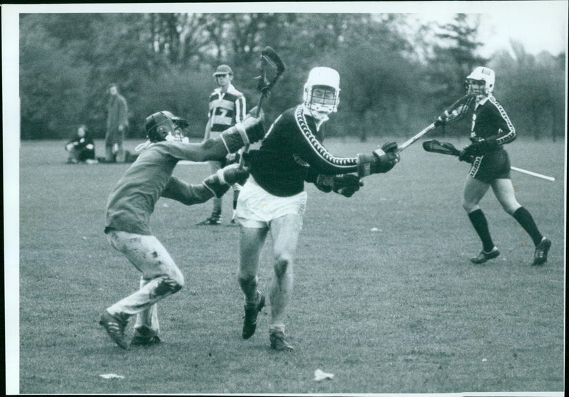 Oxford University's George Pierce shields the ball from Birmingham University's Fergus Wilson during their match in the Parks. - Vintage Photograph