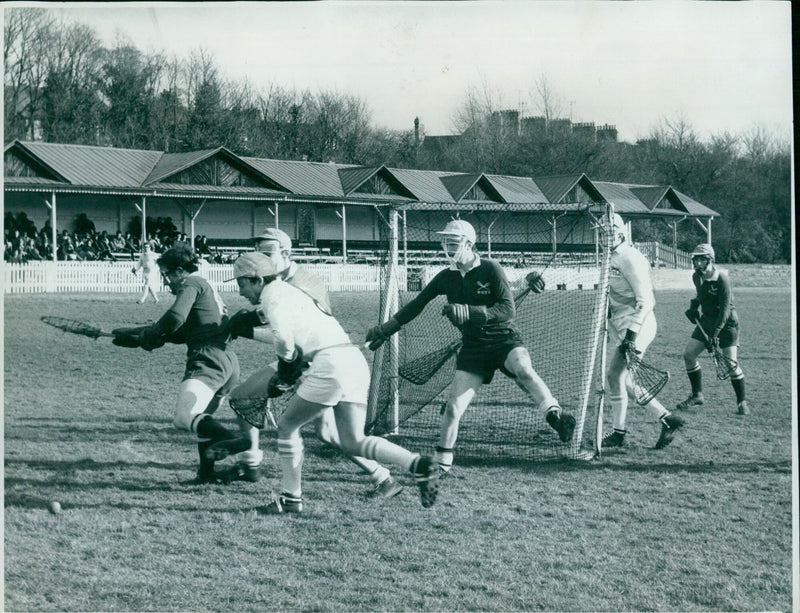 Action in the Cambridge goalmouth as attackers and defenders fight for the ball during yesterday's Varsity lacrosse match. - Vintage Photograph