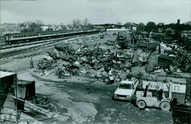 A scrapyard in Oxford, England is seen filled with debris and discarded items. - Vintage Photograph