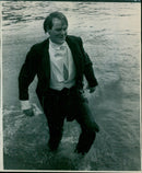Staff members of a company measuring a trench. - Vintage Photograph