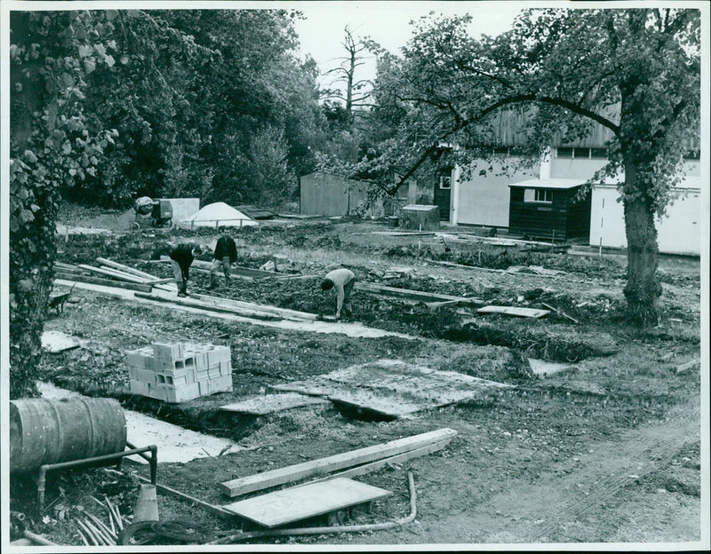 Construction begins on a new boat house on the banks of the Isis River in Oxford. - Vintage Photograph