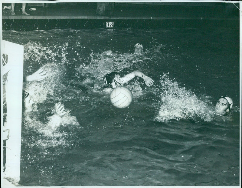 Oxford Mail's D. Woodwark dives for a loose ball during a water polo practice session. - Vintage Photograph