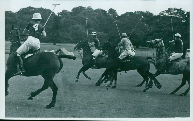 Polo players engage in a mid-field battle between Oxford and Coberley Grange. - Vintage Photograph