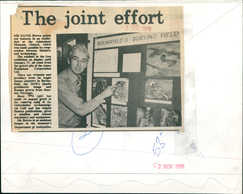 Archaeologist David Brown points out features of an exhibition at the Ashmolean Museum in Oxford, made possible by collaboration between industry and archaeology. - Vintage Photograph