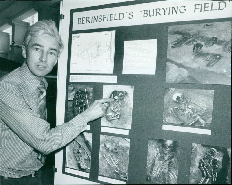 Archaeologist David Brown points out features of an exhibition at the Ashmolean Museum in Oxford, made possible by collaboration between industry and archaeology. - Vintage Photograph