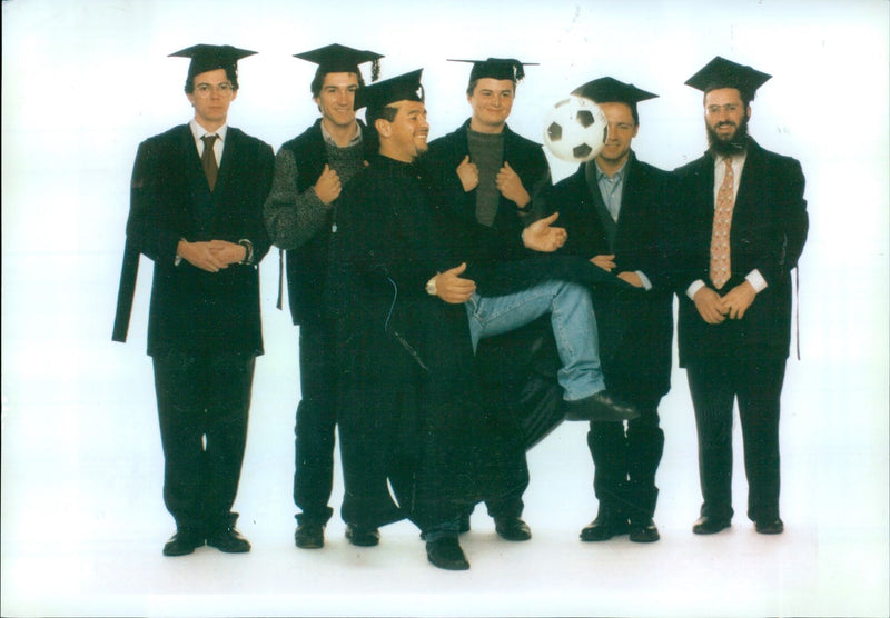 Students of Oxford University celebrate their graduation with a socially-distanced parade. - Vintage Photograph