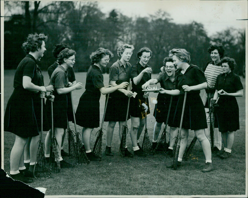 Oxford University Parks lacrosse team enjoying refreshment during a match against Cambridge. - Vintage Photograph