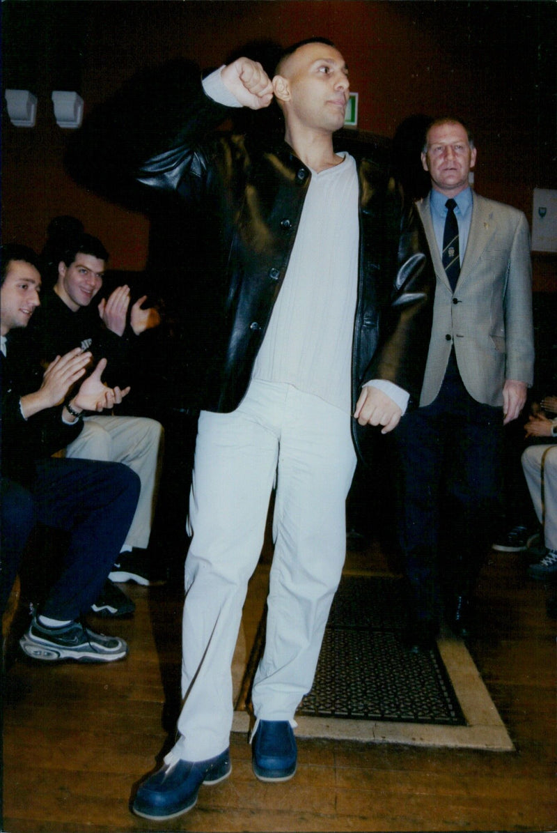 Oxford boxer Naseem Hamed speaks at the Oxford Union with president Lucy Aitkens. - Vintage Photograph